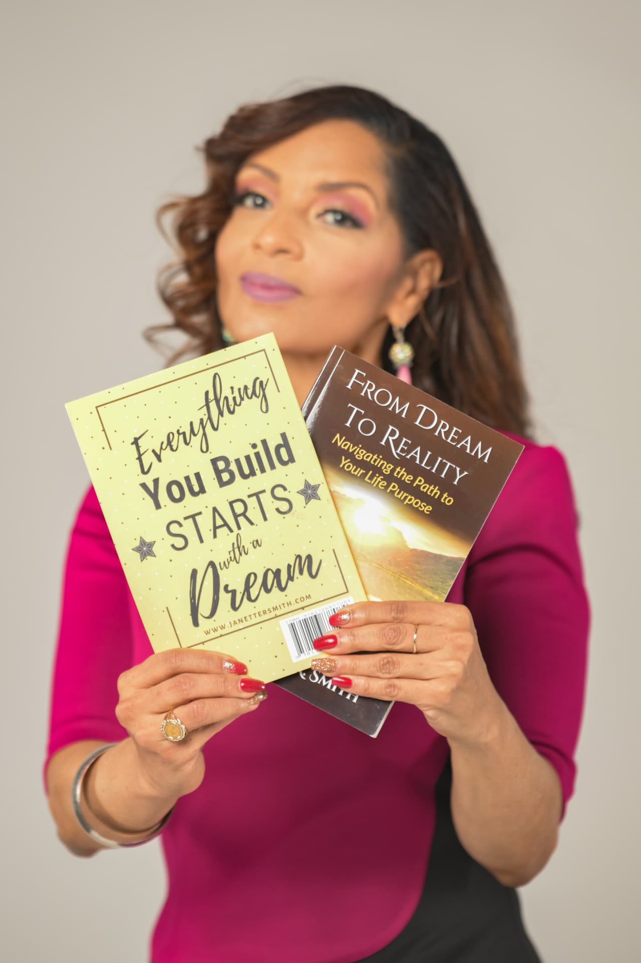 Janette R. Smith with her published books